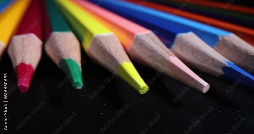 Sharp wooden multi-colored pencils on black background. Drawing training Sharp wooden multi-colored pencils on black background. Drawing training