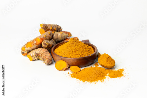 The turmeric powder is a natural herb and is an ingredient for food cooking. The colour of the turmeric powder is yellow when it dry and green when it raw. Asian curry like Indian has yellow powder. © doidam10