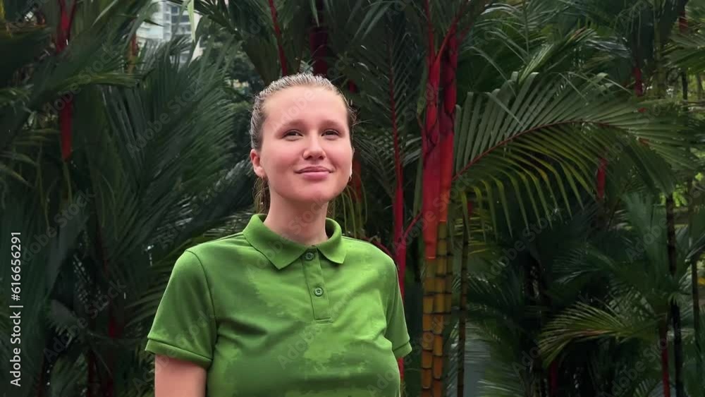 girl stands after a tropical rain in nature and enjoys the fresh air, breath deep girl stands after a tropical rain in nature and enjoys the fresh air, breath deep