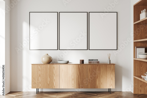 Fototapeta Light living room interior dresser and shelf with art decoration, mockup frames