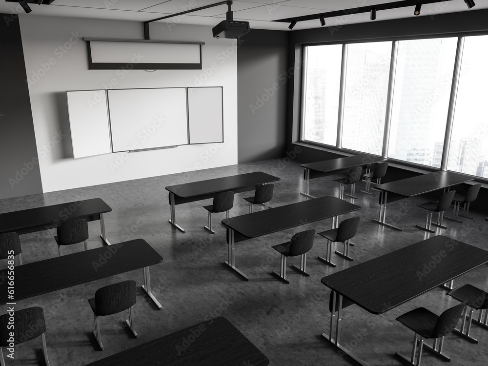 Top view of dark class room interior with table in row and empty screen