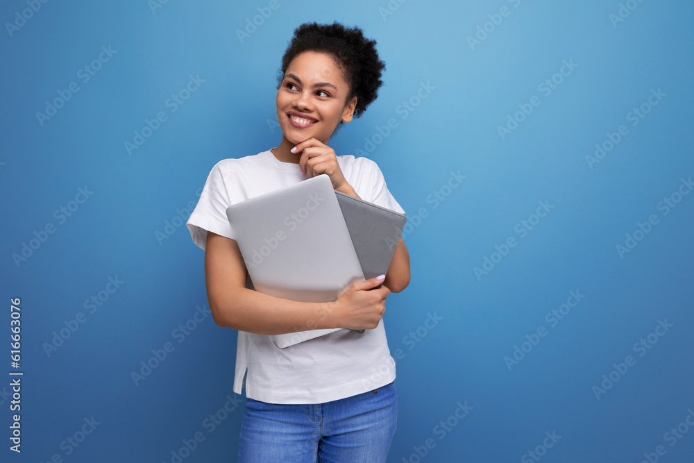 young smart hispanic business woman in white t-shirt got working remotely with laptop. business concept young smart hispanic business woman in white t-shirt got working remotely with laptop. business concept