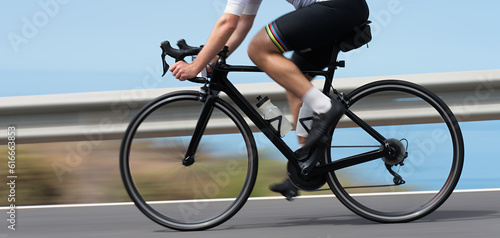 Fotografie Motion blur of a bike race with the bicycle and rider at high speed