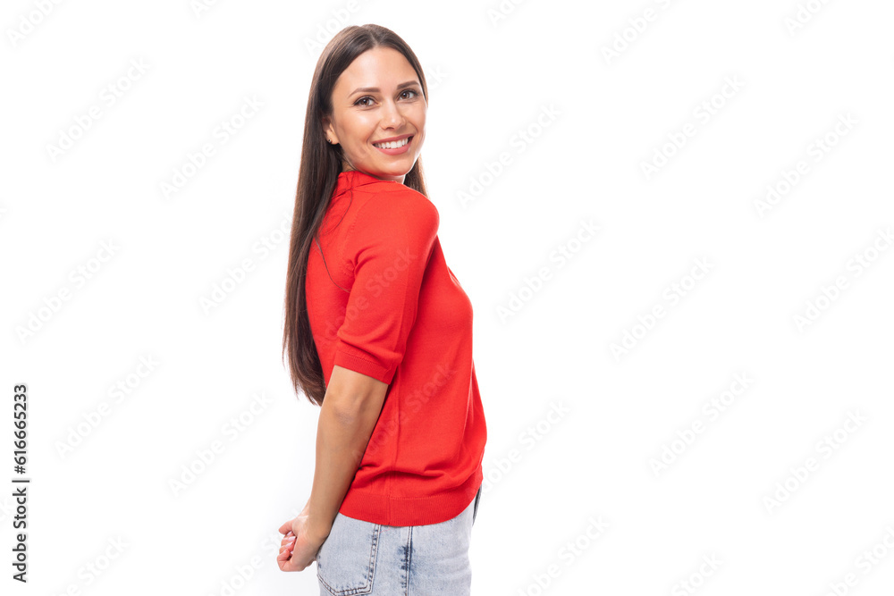 young smiling pretty caucasian brunette in a red short sleeve shirt on a white background with copy space young smiling pretty caucasian brunette in a red short sleeve shirt on a white background with copy space