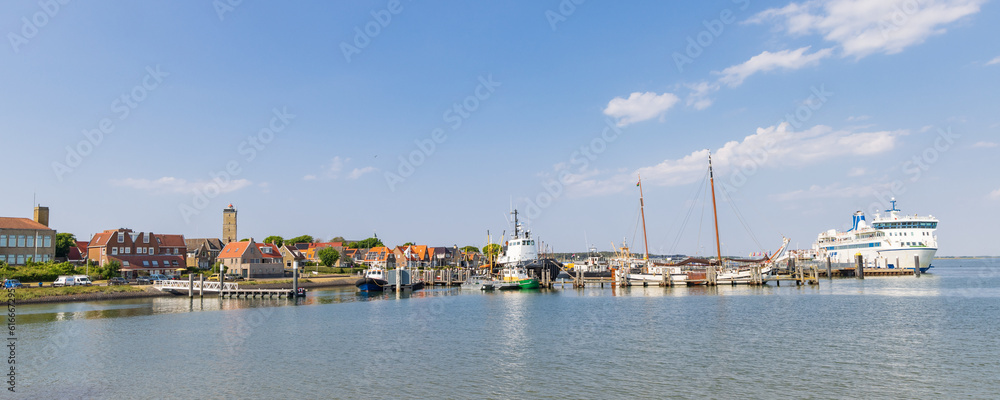 Cityscape West-Terschelling with tugboat Hunter in the harbor at Wadden island Terschelling in Friesland province in The Netherlands