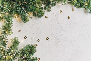 Empty white wold table top with abstract warm living room decor with christmas tree string light blur background with snow,Holiday backdrop,Mock up banner for display of advertise product