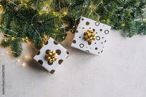 Empty white wold table top with abstract warm living room decor with christmas tree string light blur background with snow,Holiday backdrop,Mock up banner for display of advertise product