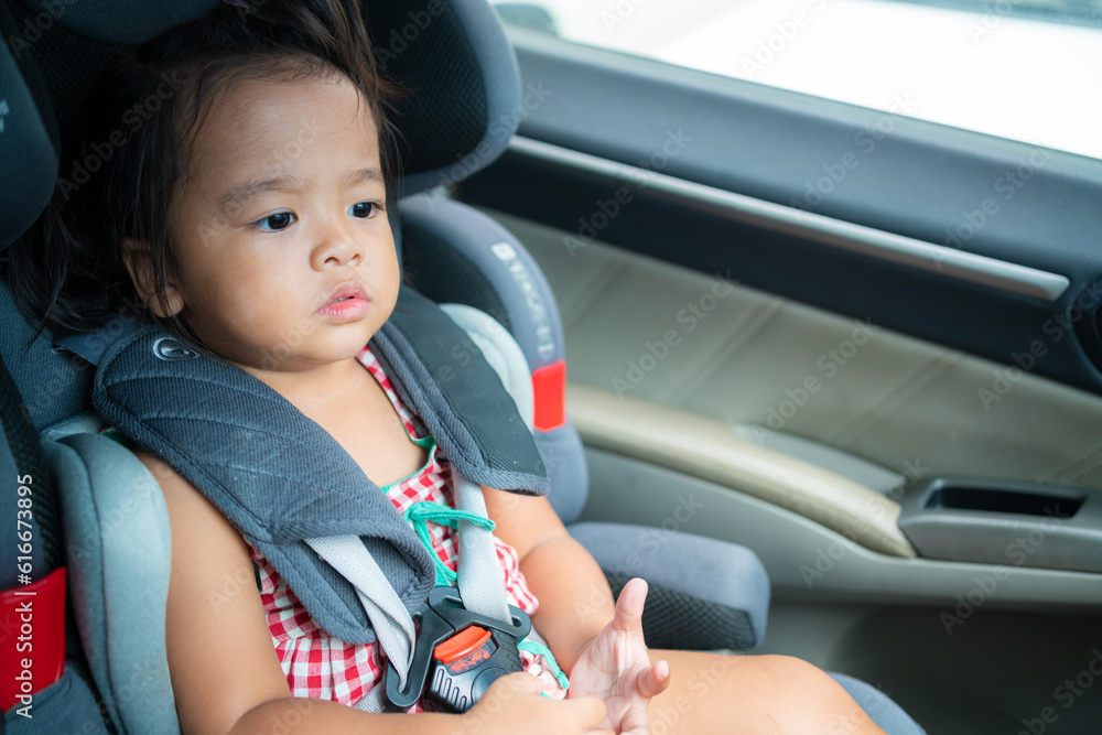 Happy preschool girl sitting on carseat while car travel trip Happy preschool girl sitting on carseat while car travel trip