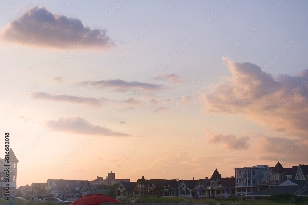 sunset sky and clouds over victorian architecture at ocean path park new jersey