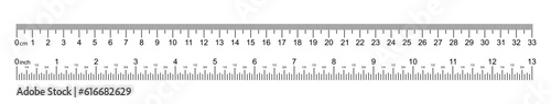 A white ruler marked with centimeters, inches and combined rectangular shapes. Output inch line. Vector graphics on a white background.