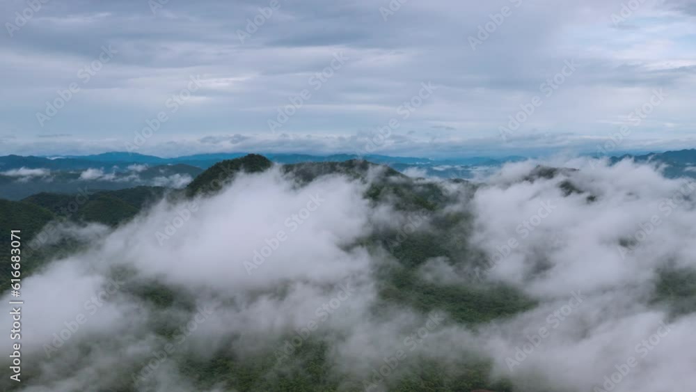 4K motion time lapse video aerial view morning scenery Mist flowing over the high mountains The movement of fog and clouds, Pang Puey, Mae Moh, Lampang, Thailand 4K motion time lapse video aerial view morning scenery Mist flowing over the high mountains The movement of fog and clouds, Pang Puey, Mae Moh, Lampang, Thailand