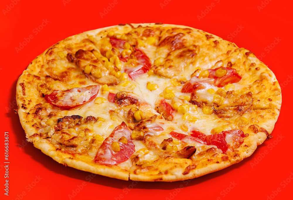 Pizza on a cream base with tomatoes, corn and mozzarella cheese