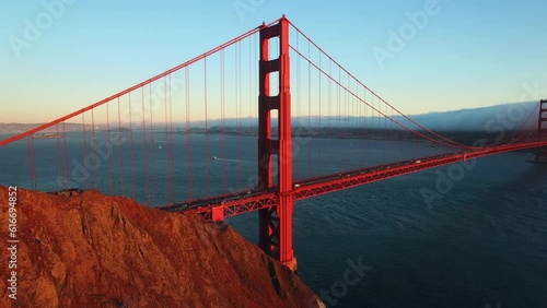 Aerial Lockdown Shot Of Famous Golden Gate Bridge On Sea Near Mountains, Drone Flying Over Landmark Against Sky - San Francisco, California
