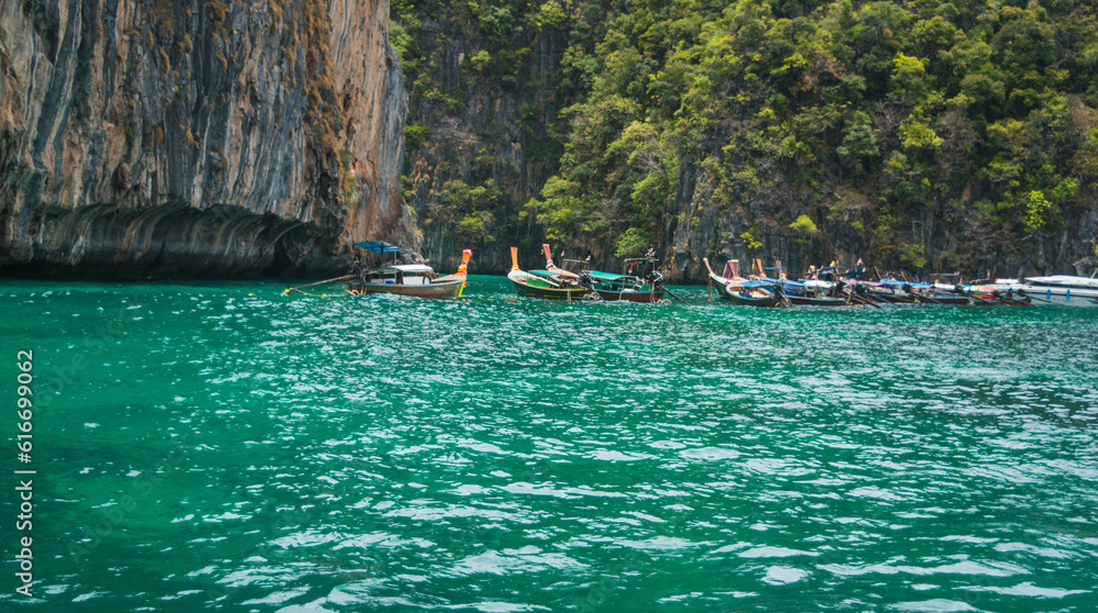 Phi Phi Island with long tail boat and white sand beach