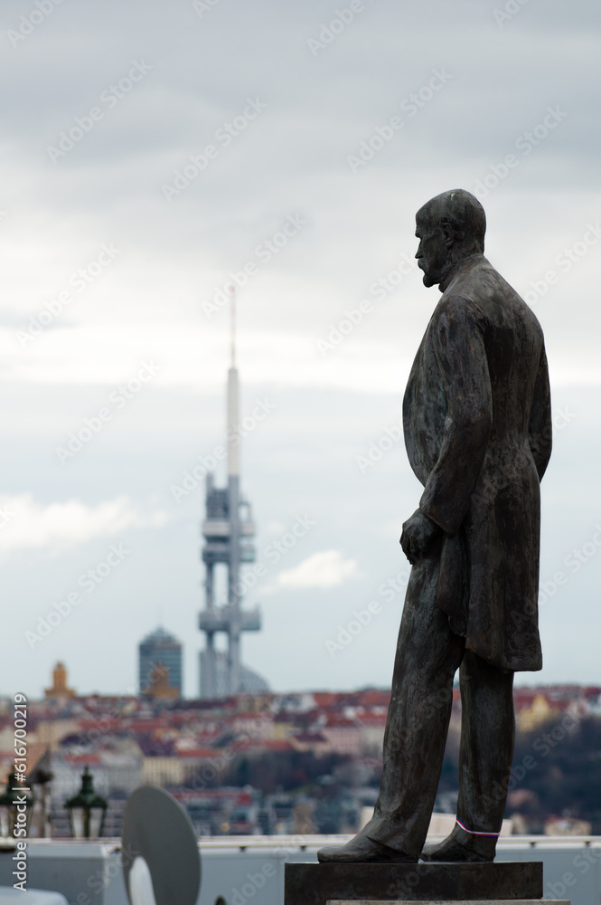 Fototapeta premium Statue of first Czechoslovak President Tomas Garrigue Masaryk at Hradcanske namesti overlookiing panorama of Prague