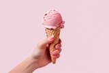 Female hand holding strawberry ice cream cone, copy space, space for text