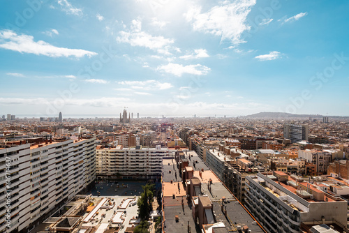 Aerial view of barcelona's metropolitan skyline, showing architectural beauty and vibrant cityscape with clouds in the background