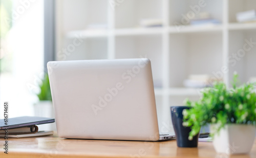 Wallpaper Mural Laptop computer, coffee cup and financial document on office desk.. Torontodigital.ca
