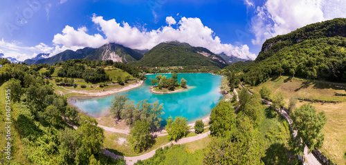 Amazing beautiful turquoise lake Tenno in Trentino region of Italy  surrouded by Alps mountains. Aerial drone panoramic view