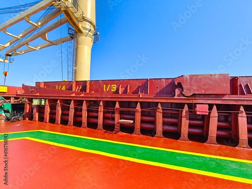 A well painted of walk way on a cargo ship