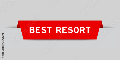 Red color inserted label with word best resort on gray background
