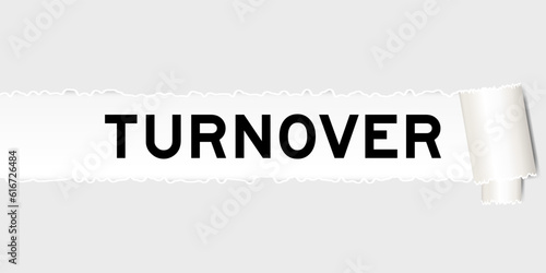 Ripped gray paper background that have word turnover under torn part