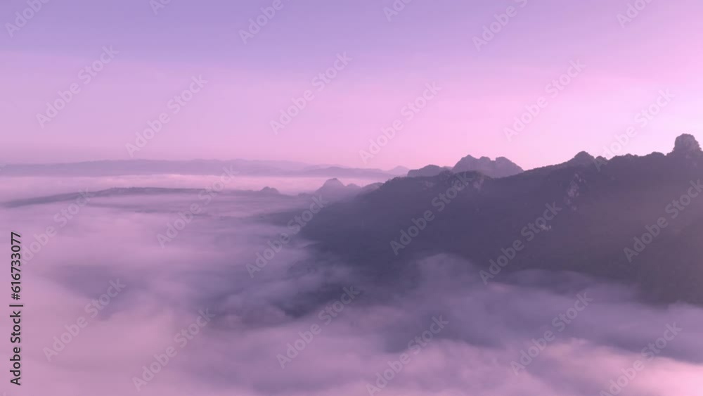 Drone video flying above the fog and clouds to the top of the fog beautiful scenery sea fog and high mountains Drone video flying above the fog and clouds to the top of the fog beautiful scenery sea fog and high mountains