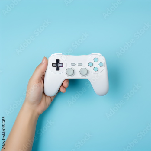 hand holding game controller isolated on plain blue studio background made with generative ai