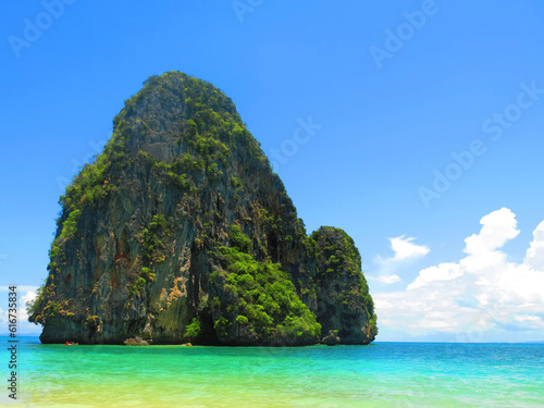 Railay Beach Krabi Thailand has islets and steep cliffs. clear green water The sky has a beautiful deep blue color.