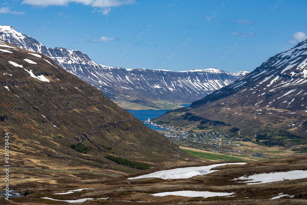 View down to seydisfjördur village and fjord in iceland in summer