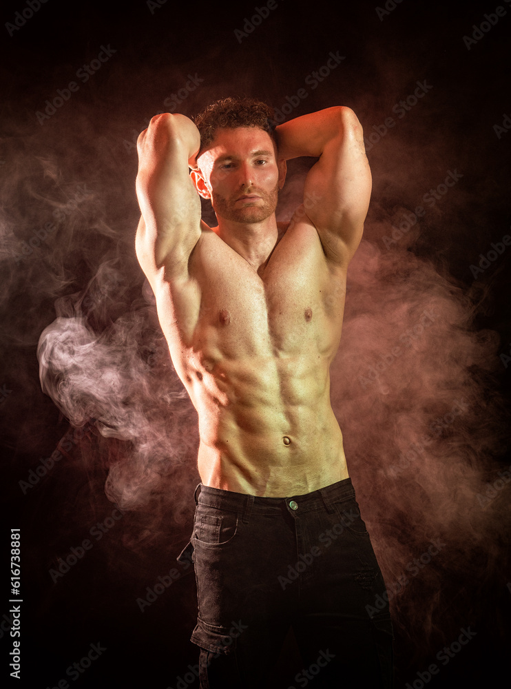 Fototapeta premium Handsome shirtless male bodybuilder in studio shot