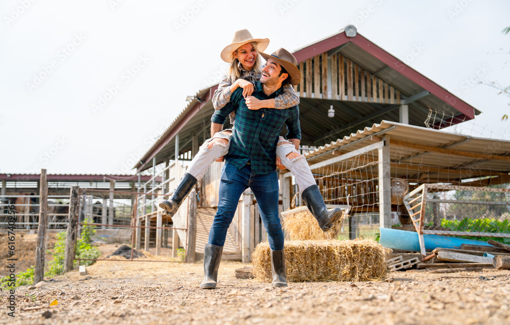 Caucasian man and woman farmer enjoy with woman riding on the back of man and go around the area of their farm with happiness and day light. Caucasian man and woman farmer enjoy with woman riding on the back of man and go around the area of their farm with happiness and day light.