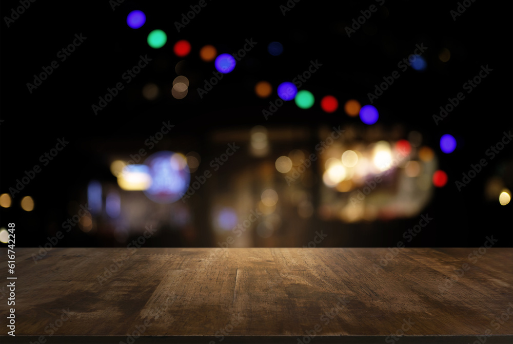 Empty of dark wooden table in front of abstract blurred background of bokeh light . can be used for display or montage your products.Mock up for display of product