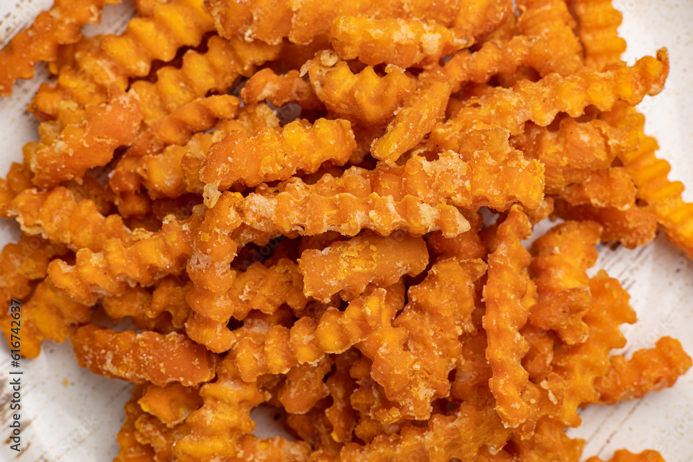 Delicious, sweet potato fries. Close-up Delicious, sweet potato fries. Close-up
