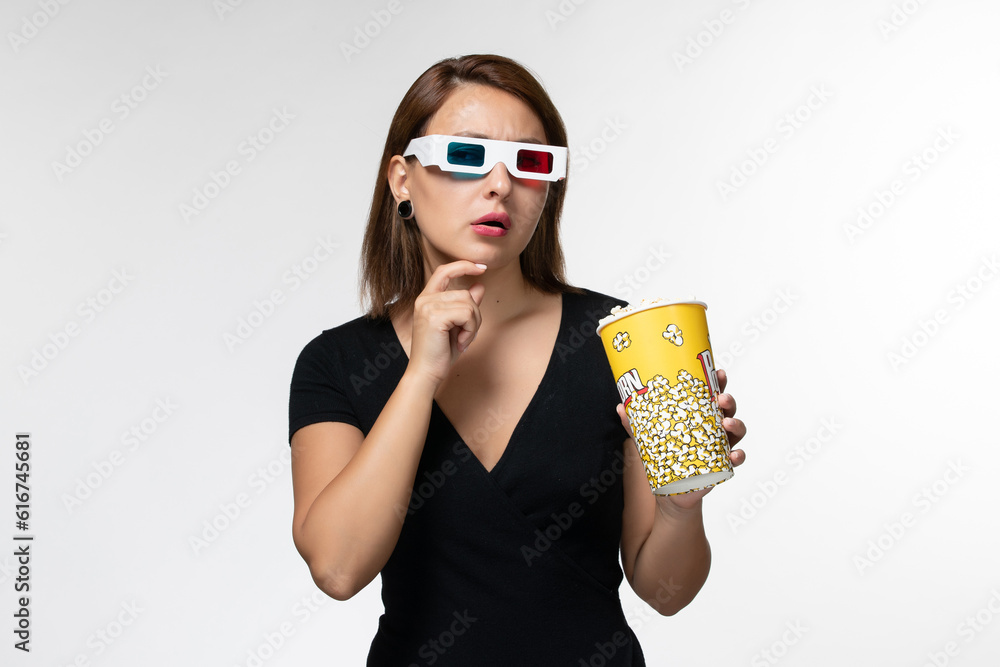 front view young female holding popcorn in d sunglasses watching movie and thinking on white background movies cinema film lonely front view young female holding popcorn in d sunglasses watching movie and thinking on white background movies cinema film lonely