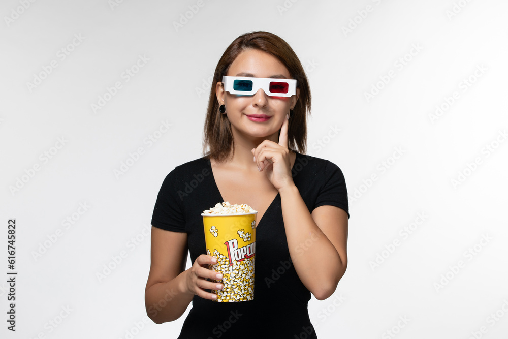 front view young female holding popcorn in d sunglasses watching movie on light white background lonely movies cinema film front view young female holding popcorn in d sunglasses watching movie on light white background lonely movies cinema film
