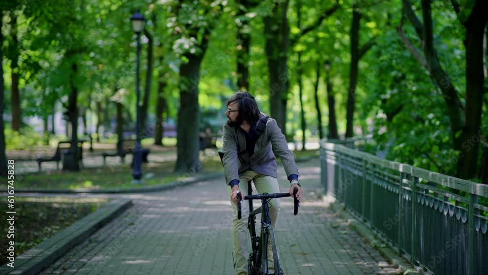 businessman riding his bike to work, commuting by bicycle businessman riding his bike to work, commuting by bicycle