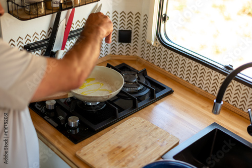 Wallpaper Mural older man cooking in his motorhome,Aromas of Culinary Adventure Torontodigital.ca