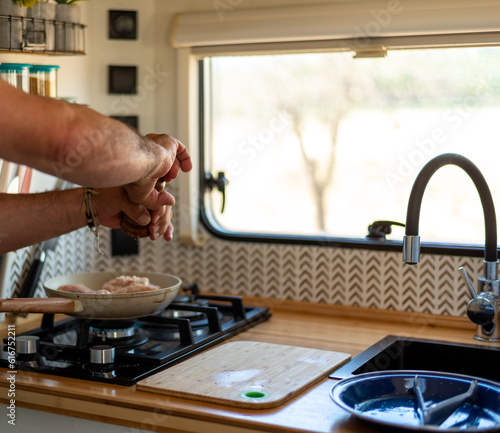 Wallpaper Mural older man cooking in his motorhome,Cooking with Passion on the Road Torontodigital.ca