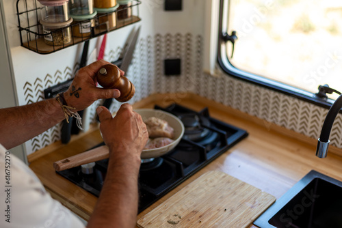 Wallpaper Mural older man cooking in his motorhome,Mobile Kitchen in Action Torontodigital.ca