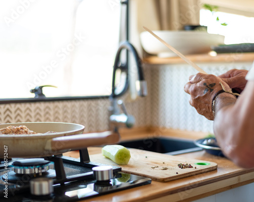 Wallpaper Mural older man cooking in his motorhome,Retirement Bliss: Cooking up Joy in the Motorhome Torontodigital.ca