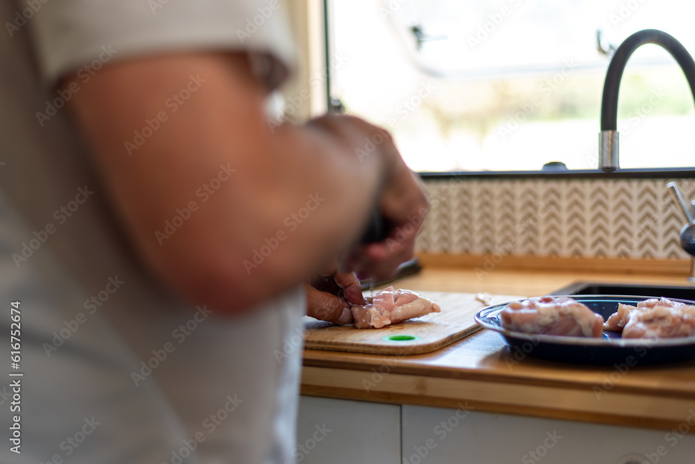 older man cooking in his motorhome,Flavors on the Road