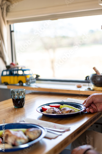 Wallpaper Mural older man cooking in his motorhome,Culinary Delights Unveiled: An Elderly Chef Showcases His Masterpieces at the Motorhome Table Torontodigital.ca
