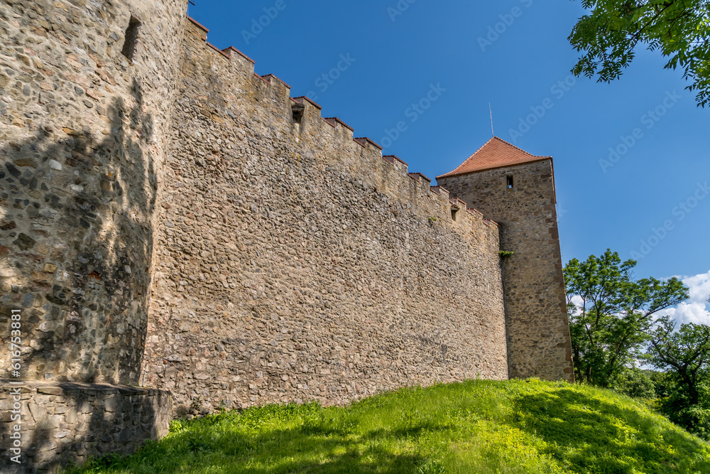Medieval wall with loopholes and rectangular tower at Veveri Castle Czechia