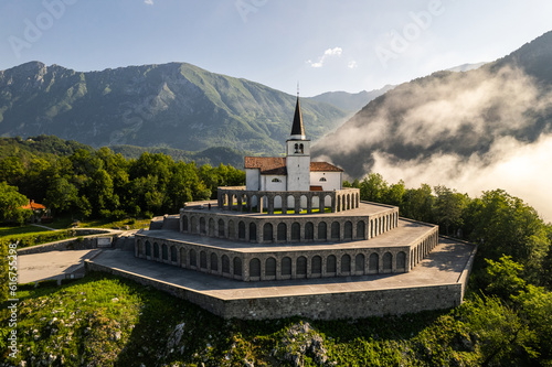 Drone view of St Anton Church and Kobarid Ossuary in Slovenia. Caporetto Memorial from First World War