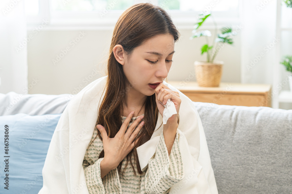 Sick, coronavirus or covid-19, illness asian young woman, girl with blanket have a fever, flu or sore throat and sneezing until chest pain while rest at home. Health care with disease, pandemic virus. Sick, coronavirus or covid-19, illness asian young woman, girl with blanket have a fever, flu or sore throat and sneezing until chest pain while rest at home. Health care with disease, pandemic virus.