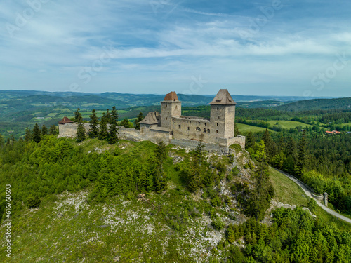 Aerial view of Kasperk Hrad or Karlsberg castle in Czechia. The central part of the castle consists of two residential towers and an oblong palace which was built between them