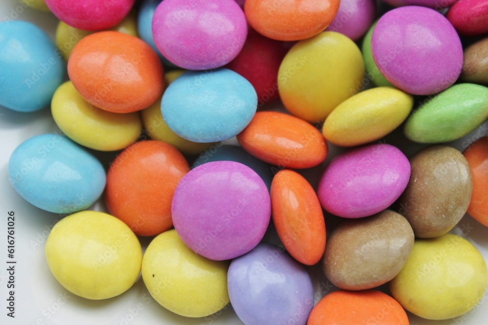 Multi colored candy coated chocolate button sprinkle texture - marties, sprinkles Multi colored candy coated chocolate button sprinkle texture - marties, sprinkles