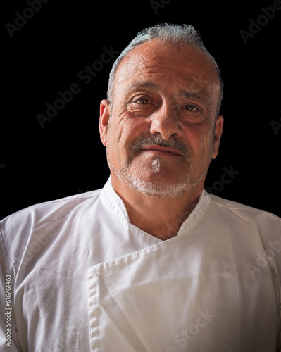 Wallpaper Mural portrait of chef major, studio portrait, black background, vertical image,Master of Flavors: Capturing the Essence of Culinary Artistry Torontodigital.ca