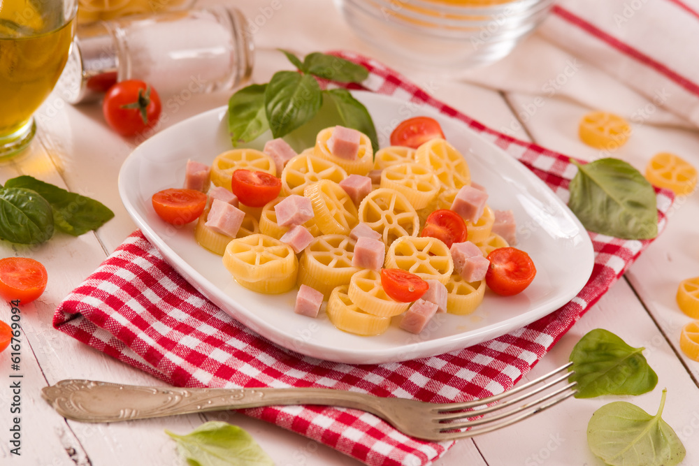 Ruote pasta with tomato and ham. Ruote pasta with tomato and ham.